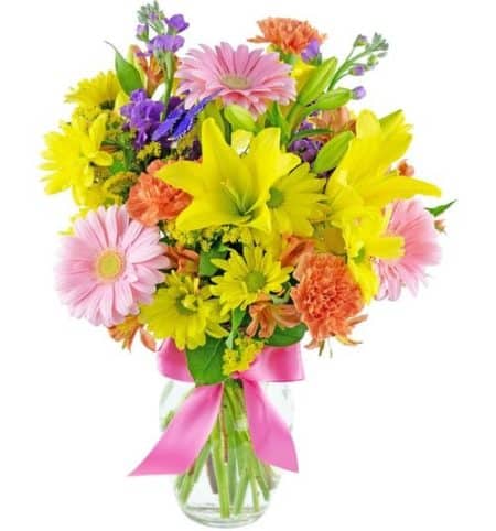 Encourage and cheer them with a bright beautiful bouquet of flowers. It's a bold mix of pink, yellow, purple and orange, and available in two sizes.