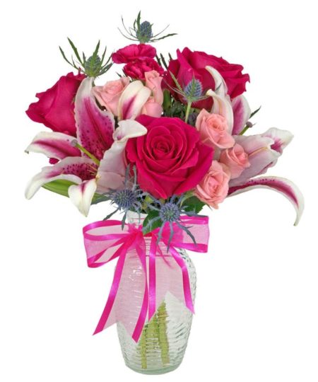 A pretty in pink design in a clear glass vase, Just Happy features stargazer lilies, hot pink roses, light pink spray roses, and is accented with thistle and more. It's a gorgeous design in shades of pink, available in three sizes...each upgrade will include the same varieties, with more flowers and a larger vase.